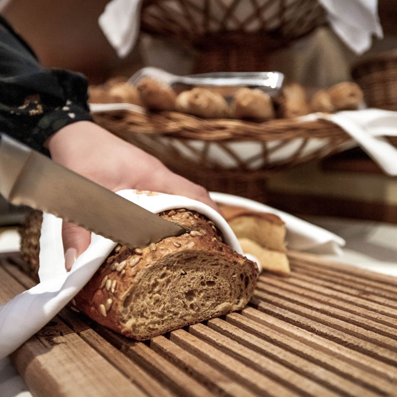 Slicing bread for breakfast Obertauern